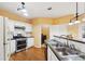 Well-appointed kitchen with white cabinets, stainless steel appliances, and ample counter space at 485 Kensington Parc Dr, Avondale Estates, GA 30002