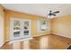 A bright living room has hardwood floors and access to the backyard deck at 485 Kensington Parc Dr, Avondale Estates, GA 30002