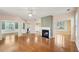 Open living space with hardwood flooring and a white fireplace at 485 Kensington Parc Dr, Avondale Estates, GA 30002