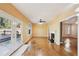 A light filled living room has hardwood floors, a ceiling fan, and access to a deck at 485 Kensington Parc Dr, Avondale Estates, GA 30002