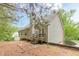 View of the backyard featuring a patio and a wooden deck with steps at 4671 W Lake Se Dr, Conyers, GA 30094