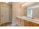 Bathroom features a double vanity with two sinks, white marble countertop, and updated fixtures at 4671 W Lake Se Dr, Conyers, GA 30094