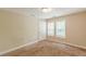 Cozy bedroom featuring two windows and neutral-toned walls at 4671 W Lake Se Dr, Conyers, GA 30094