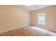 Bedroom featuring carpeted floors and a window to allow natural light in at 4671 W Lake Se Dr, Conyers, GA 30094