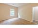 Bedroom featuring carpet floors and natural light coming through a window at 4671 W Lake Se Dr, Conyers, GA 30094