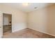 Bedroom featuring carpet floors and natural light coming through a window at 4671 W Lake Se Dr, Conyers, GA 30094