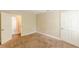 Bedroom featuring an ensuite bathroom, neutral-toned walls, and hardwood floors at 4671 W Lake Se Dr, Conyers, GA 30094