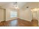 Spacious bedroom with hardwood floors, a large window, and a ceiling fan at 4671 W Lake Se Dr, Conyers, GA 30094