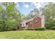 Charming two-story brick home with manicured lawn and inviting entrance at 4671 W Lake Se Dr, Conyers, GA 30094