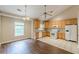 Open kitchen featuring wood cabinets and modern appliances and breakfast area at 4671 W Lake Se Dr, Conyers, GA 30094