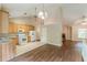 Bright eat-in kitchen features wood cabinets, granite countertops, white appliances and access to living room at 4671 W Lake Se Dr, Conyers, GA 30094
