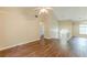 Open-concept living room with vaulted ceilings and hardwood floors at 4671 W Lake Se Dr, Conyers, GA 30094