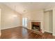 Living room featuring hardwood floors, fireplace, lots of light and hardwood floors at 4671 W Lake Se Dr, Conyers, GA 30094