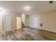 Spacious living area with laminate flooring, a stairway, and neutral paint is ready for your personal touch at 4671 W Lake Se Dr, Conyers, GA 30094