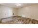 A spacious, empty living room with laminate flooring, ready to be furnished at 4671 W Lake Se Dr, Conyers, GA 30094
