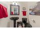 Black and red bathroom with pedestal sink and toilet at 1045 Sterling Ridge Chase, Marietta, GA 30062