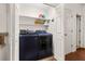 Convenient laundry room with washer, dryer, and shelving at 1045 Sterling Ridge Chase, Marietta, GA 30062