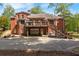 Large deck with patio and attached garage at 502 Watermill Way, Suwanee, GA 30024