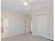 Spacious bedroom with neutral decor and double doors to closet at 502 Watermill Way, Suwanee, GA 30024