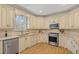 Modern kitchen with stainless steel appliances and granite counters at 502 Watermill Way, Suwanee, GA 30024