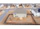 Backyard aerial view showcasing the home, fenced yard, and neighborhood at 7710 Tiberon Pkwy, Cumming, GA 30028