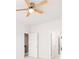 Bright bedroom with a ceiling fan and multiple doors to other rooms at 7710 Tiberon Pkwy, Cumming, GA 30028