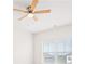 Bedroom featuring ceiling fan and large window providing ample natural light at 7710 Tiberon Pkwy, Cumming, GA 30028