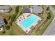 Aerial view of a community pool with lounge chairs and landscaping at 7710 Tiberon Pkwy, Cumming, GA 30028