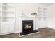 Cozy fireplace with built-in shelving at 7710 Tiberon Pkwy, Cumming, GA 30028