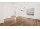 Spacious living room features hardwood floors, white trim, and lots of natural light at 7710 Tiberon Pkwy, Cumming, GA 30028