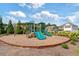A well-maintained community playground featuring dual slides and cushioned play area for children at 7710 Tiberon Pkwy, Cumming, GA 30028