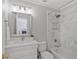 Bathroom features a modern vanity with a sink, and a tiled shower and bathtub combo at 96 Grand Ave, Suwanee, GA 30024