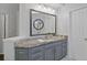 Bright bathroom vanity with granite countertops and gray cabinets at 96 Grand Ave, Suwanee, GA 30024