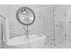 Soaking tub next to a glass shower in a well-lit bathroom at 96 Grand Ave, Suwanee, GA 30024