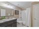 Classic bathroom featuring granite counters, updated fixtures, and shower with tub at 96 Grand Ave, Suwanee, GA 30024