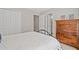Cozy bedroom features a comfortable bed, ample closet space, and traditional wood dresser at 96 Grand Ave, Suwanee, GA 30024