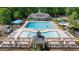 Community pool area with multiple pools, lounge chairs, cabanas, and well-maintained landscaping, perfect for summer fun at 96 Grand Ave, Suwanee, GA 30024