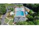 Aerial view of the community pool area with multiple pools, lounge chairs, umbrellas, and manicured landscaping at 96 Grand Ave, Suwanee, GA 30024