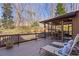Enjoy outdoor living on this deck with lounge chairs and a screened-in porch, perfect for relaxation and entertaining at 96 Grand Ave, Suwanee, GA 30024