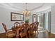 Formal dining room featuring a wooden table set and a bay window at 96 Grand Ave, Suwanee, GA 30024