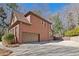 Beautiful brick home with a two-car garage and spacious driveway in a suburban neighborhood at 96 Grand Ave, Suwanee, GA 30024