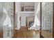 Elegant foyer with hardwood floors, staircase, and a view of the living spaces at 96 Grand Ave, Suwanee, GA 30024