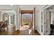 Grand foyer with hardwood floors and view to the green front yard at 96 Grand Ave, Suwanee, GA 30024