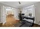 Well-lit home office with double doors leading to the dining room at 96 Grand Ave, Suwanee, GA 30024