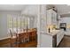 Kitchen featuring marble countertops, stainless steel appliances, and attached breakfast nook at 96 Grand Ave, Suwanee, GA 30024