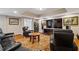 Finished basement with leather recliners, a large screen television, and hardwood-style flooring at 96 Grand Ave, Suwanee, GA 30024