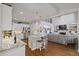 Open-concept kitchen and living room with island and hardwood floors at 96 Grand Ave, Suwanee, GA 30024