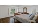 Spacious main bedroom boasts hardwood floors, abundant natural light, and tray ceiling at 96 Grand Ave, Suwanee, GA 30024