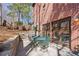 Outdoor patio with dining area and access to a brick home at 96 Grand Ave, Suwanee, GA 30024