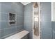 Shower with pebble-stone bench and rainfall shower head at 3979 Doral Cir, Atlanta, GA 30360